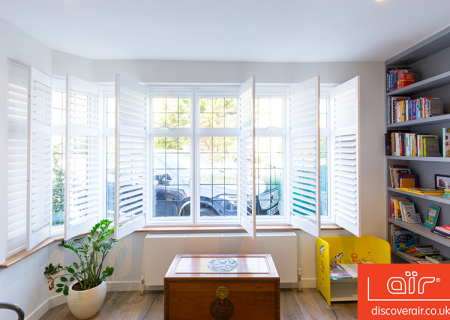 White-aluminium-windows-in-a-room-with-a-bookshelf