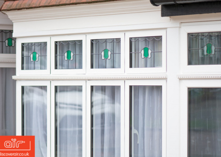 White-aluminium-windows-with-decorative-glass-design-in-Ruislip