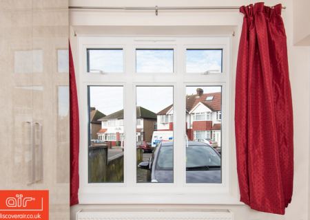 Red-curtains-next-to-air-flush-aluminium-windows
