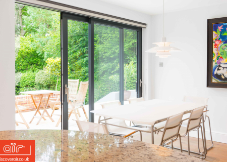 Aluminium-lift-and-slide-doors-in-dining-room-in-Brent-Cross